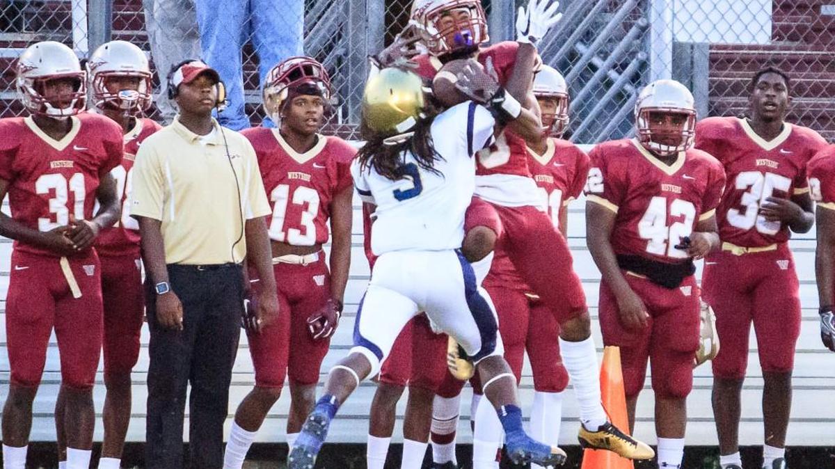 Westside's Jaylon Barden (10) catches a long pass over B.E.S.T. Academy's Sheldon Garmon (5).