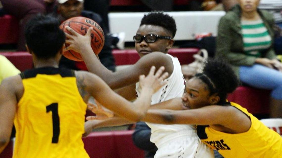 LeTerria Mathis, center, and the Warner Robins Demons open GHSA Class 5A Tournament play Friday at home against Morrow.