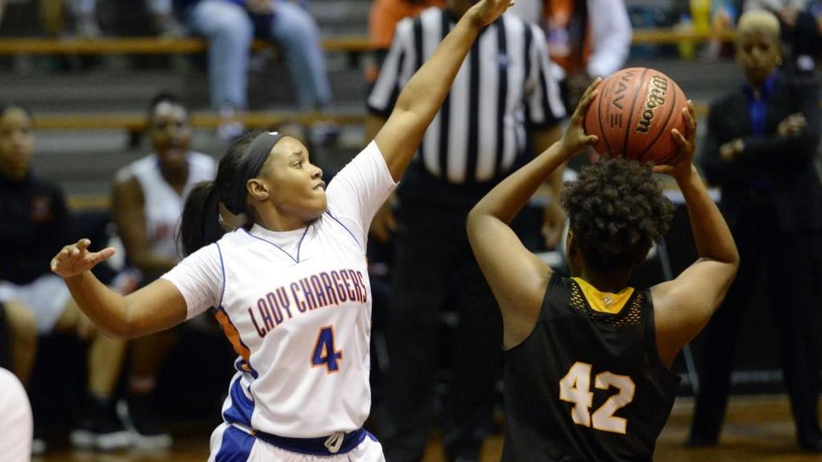 Central’s ReNesha Goolsby (4) puts the defense on Peach County’s Ileha Pickens (42) during their game Friday.