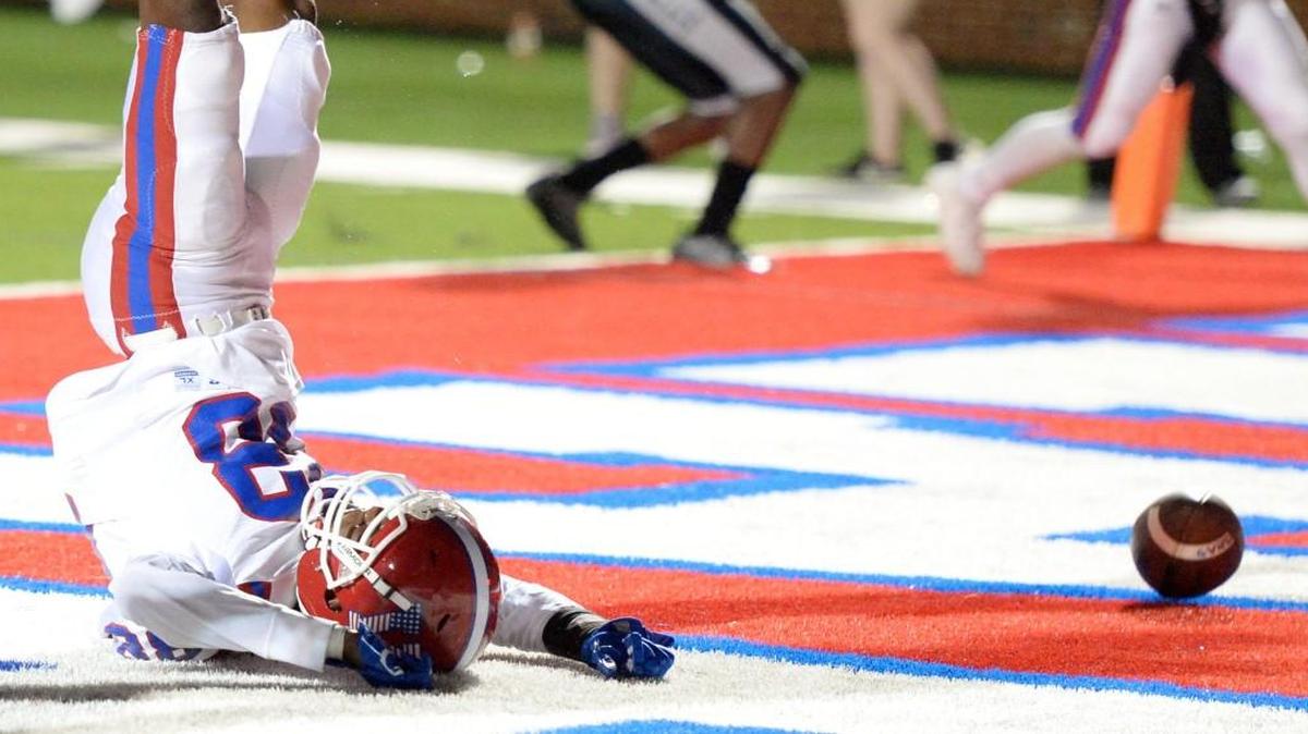 Veterans receiver Zytorian Williams (88) rolls up on his head after he can't come down with the ball in the end zone on the final play of the game during the Warhawks loss to Houston County on Friday night.