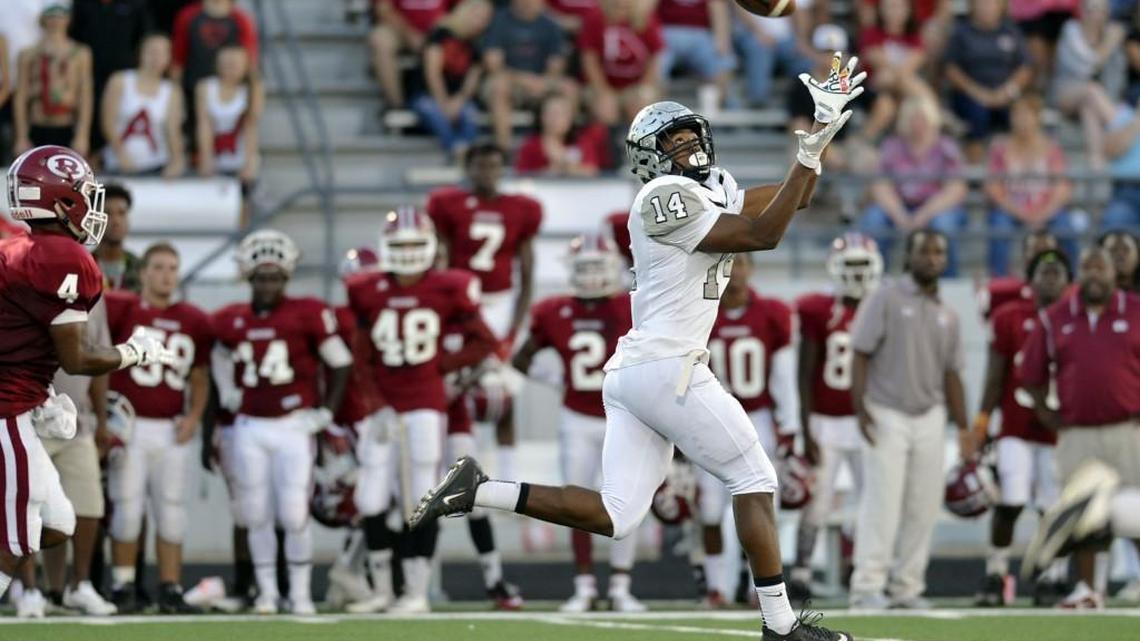 Houston County receiver Eli Watson (14) catches a long pass from Jake Fromm for a first-half touchdown Thursday against Warner Robins.