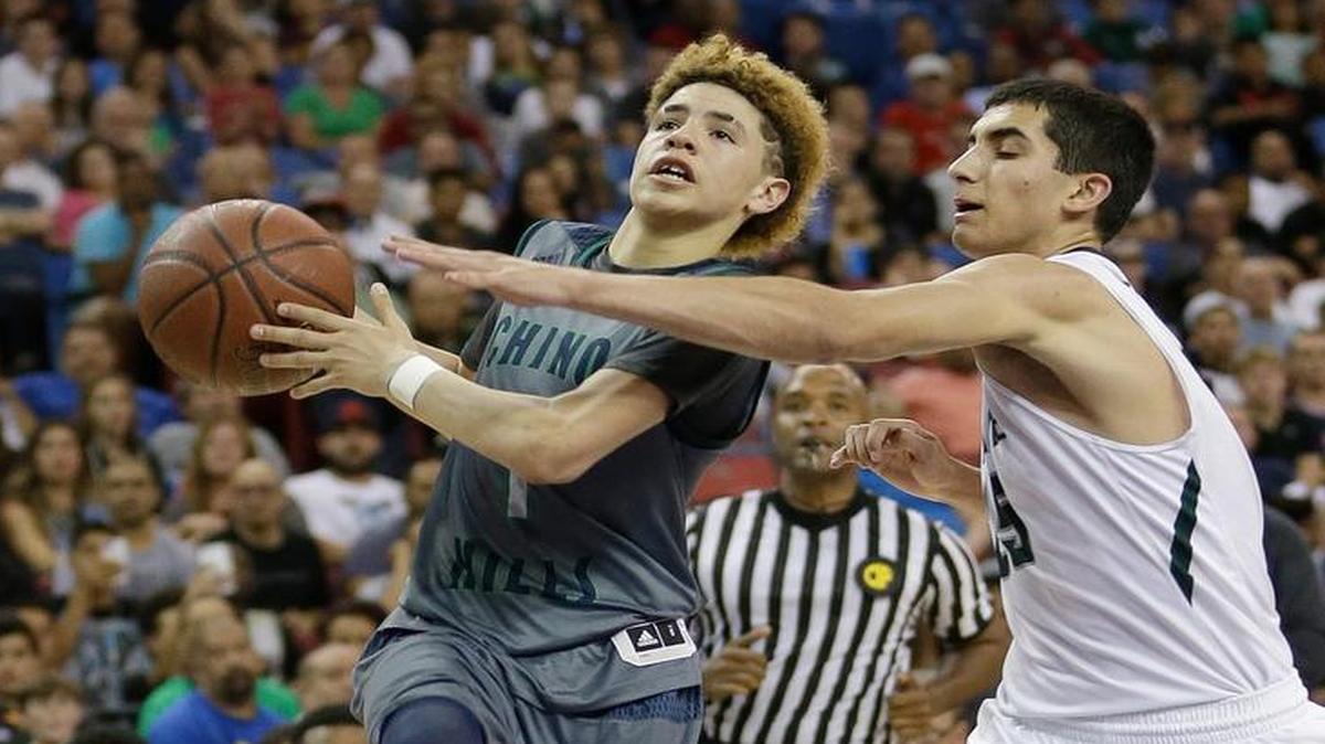 In this March 26, 2016, file photo, Chino Hills’ Lamelo Ball, left, goes to the basket against De La Salle’s Jordan Ratinho during the second half of the CIF boys Open Division high school basketball championship game in Sacramento, California. Ball scored 92 points to help Chino Hills beat Los Osos 146-123 on Tuesday.