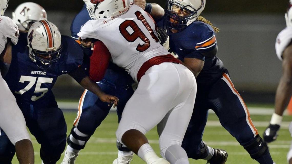 Lee County nose guard Aubrey Solomon (91) got the kind of attention any other 5-star recruit would get from Northside blockers, including Larry Thomas (75), Ham Williams (middle) and Caleb Kelly (right) Friday. Northside won 26-7.