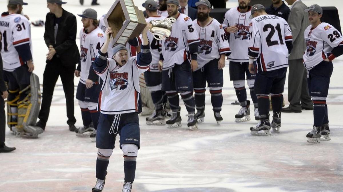 Macon Mayhem players lined up for a shot at hoisting the championship trophy after beating Peoria last season.