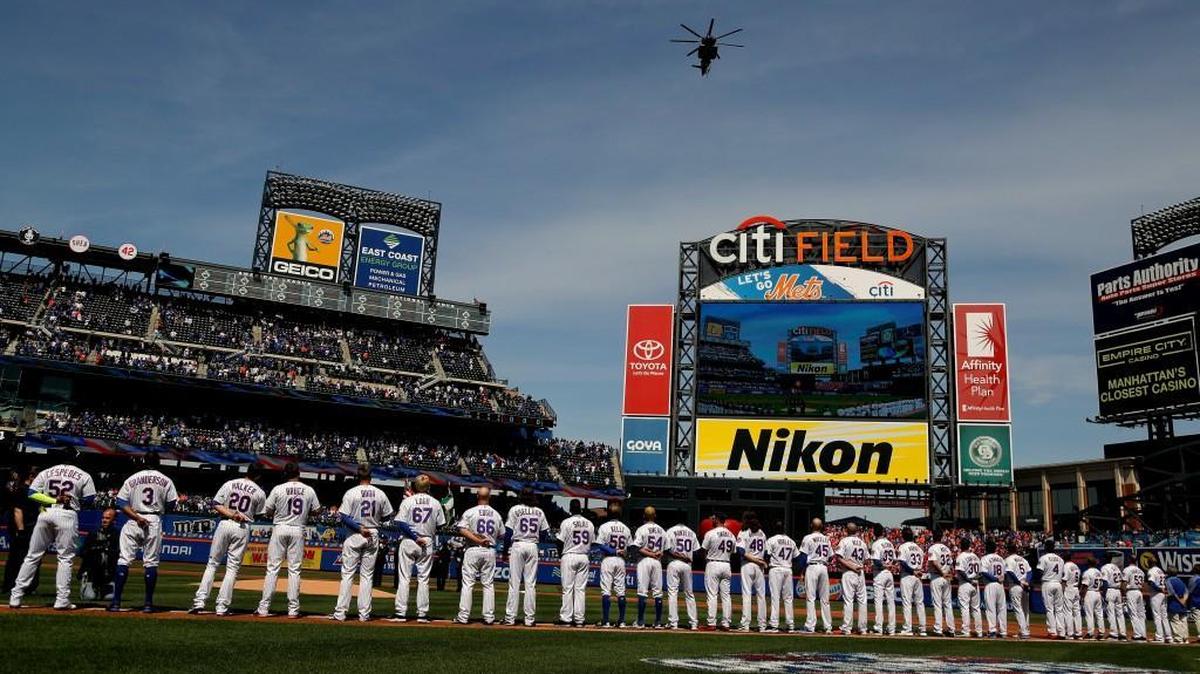 A military helicopter flies over Citi Field at the start of the New York Mets’ opening day baseball game against the Atlanta Braves on Monday in New York.