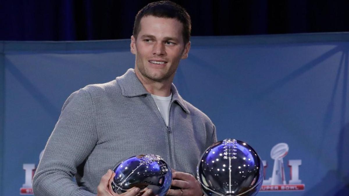 In this Feb. 6, file photo, New England Patriots quarterback Tom Brady walks off with his MVP trophy during a news conference after the NFL Super Bowl 51 football game in Houston. Zoo Atlanta announced Monday that it named a baby cockroach after Brady.