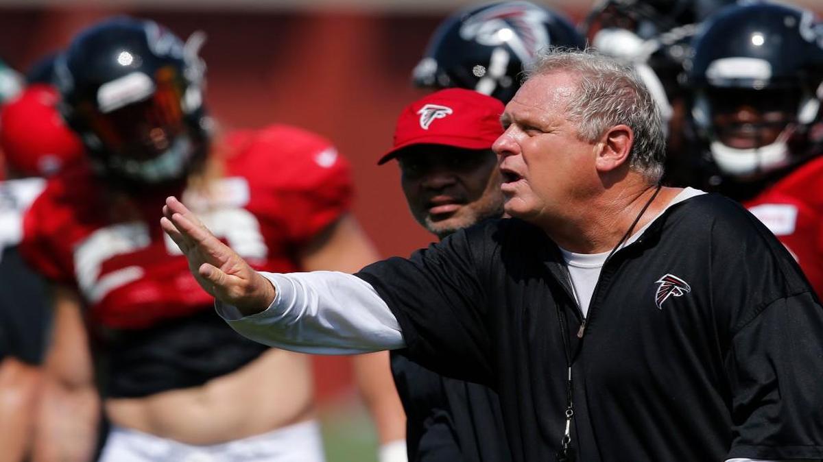 In this Aug. 2 file photo, Atlanta Falcons defensive coordinator Richard Smith signals to his players during an NFL football practice in Flowery Branch. After squandering a 25-point lead in the Super Bowl, the Falcons are shaking up their defensive staff. The team said Wednesday that head coach Dan Quinn has dismissed coordinator Richard Smith and defensive line coach Bryan Cox, although there's a chance Smith could stay with the Falcons in an advisory role.