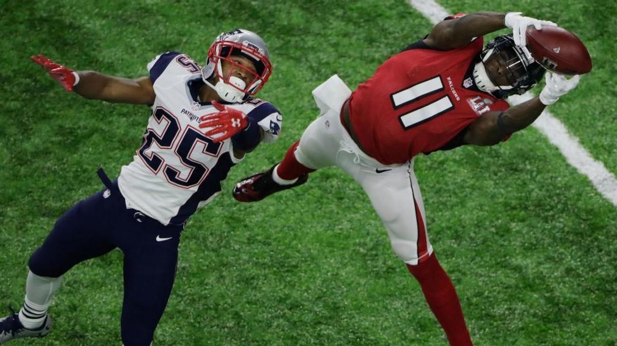 Atlanta’s Julio Jones (11) makes a catch against New England defensive back Eric Rowe during the Super Bowl on Sunday, February 5, 2017.