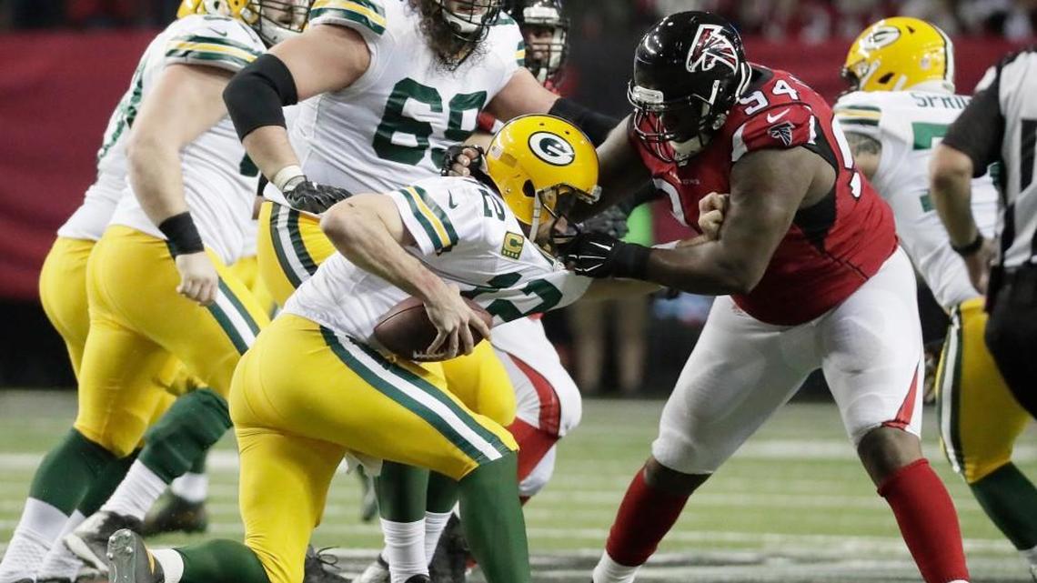 Atlanta’s Tyson Jackson sacks Green Bay quarterback Aaron Rodgers on Sunday during the NFC championship game.