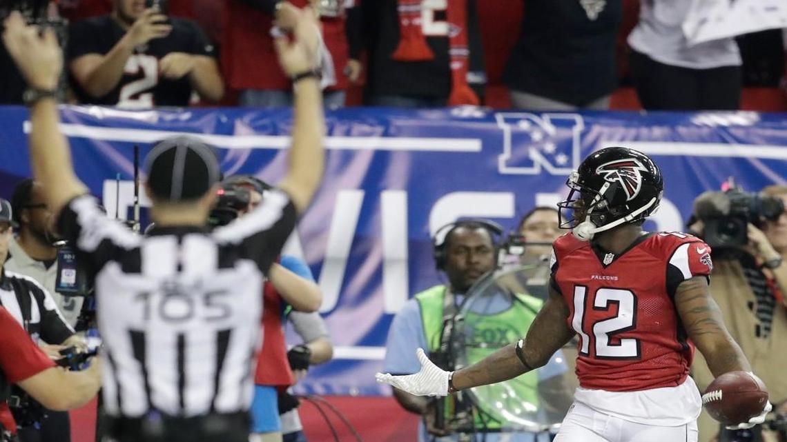 Atlanta wide receiver Mohamed Sanu (12) celebrates his touchdown against Seattle during the second half of Saturday’s NFC divisional playoff game at the Georgia Dome.