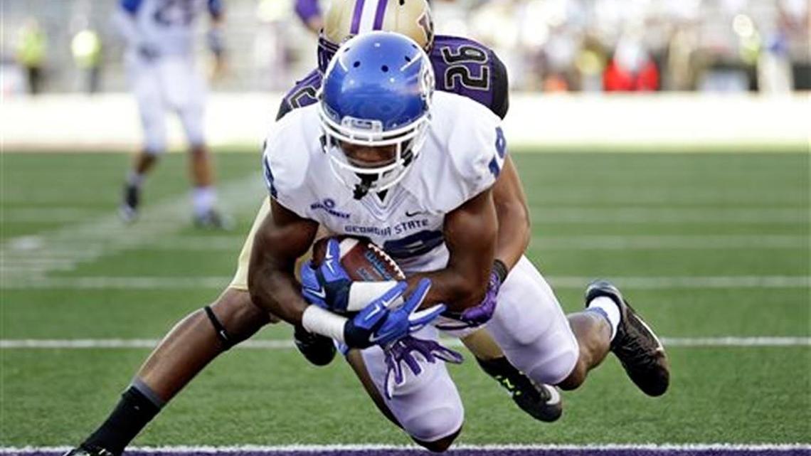 Georgia State's Robert Davis dives into the end zone on a 9-yard touchdown reception as Washington's Sidney Jones defends in a 2014 game. Davis had four catches and a touchdown in the loss.