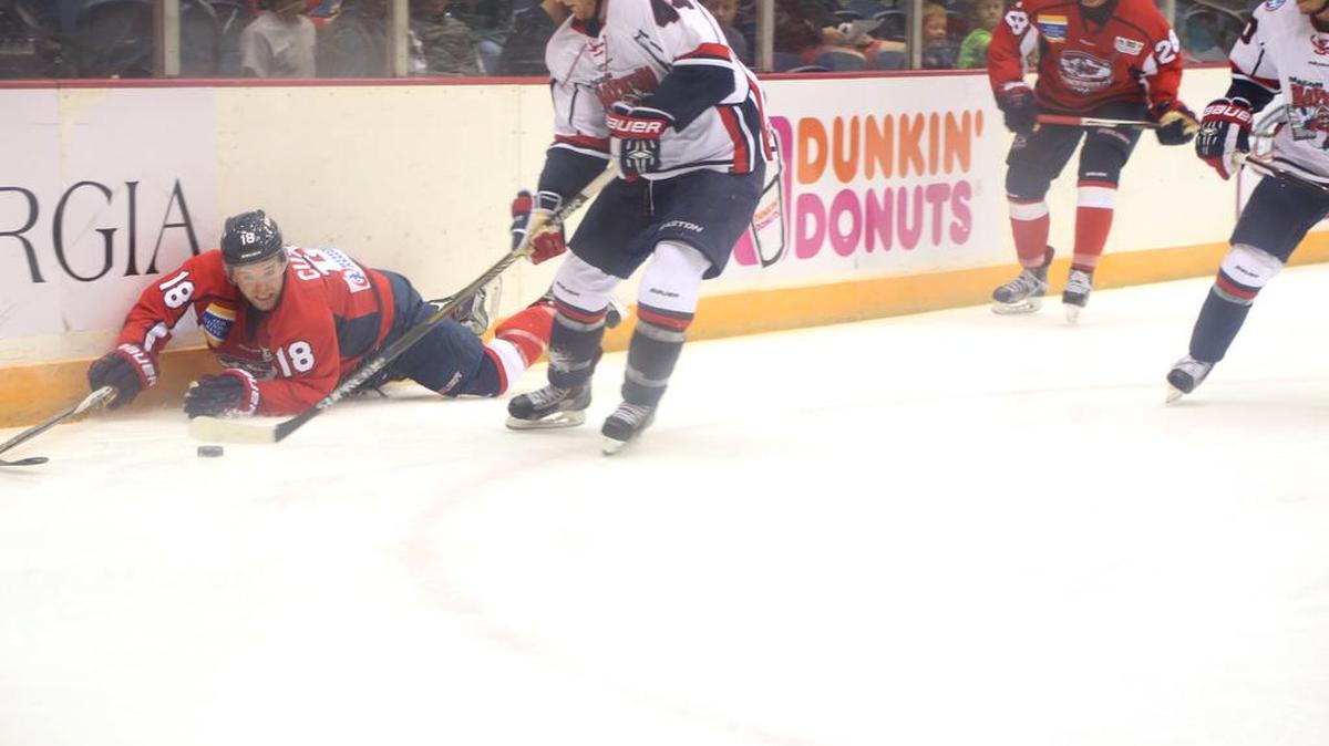 Center Stephen Pierog steals the puck from forward Austin Cody.