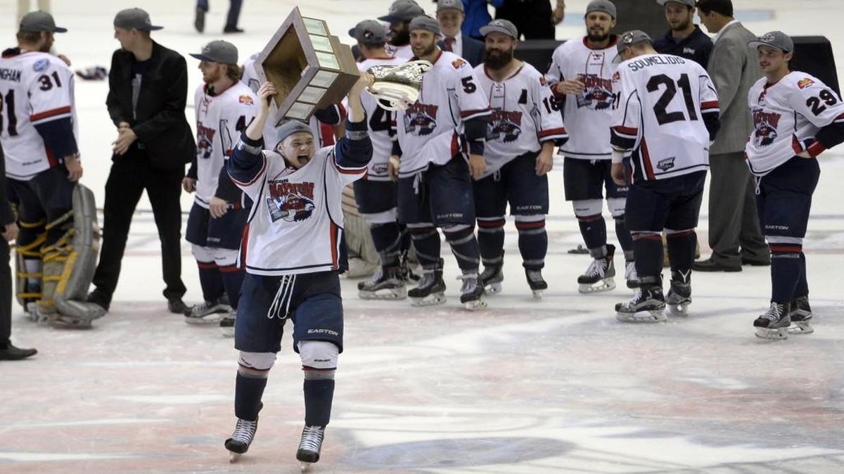 Macon Mayhem players lined up for a shot at hoisting the championship trophy after beating Peoria in the SPHL President’s Cup final April 30.