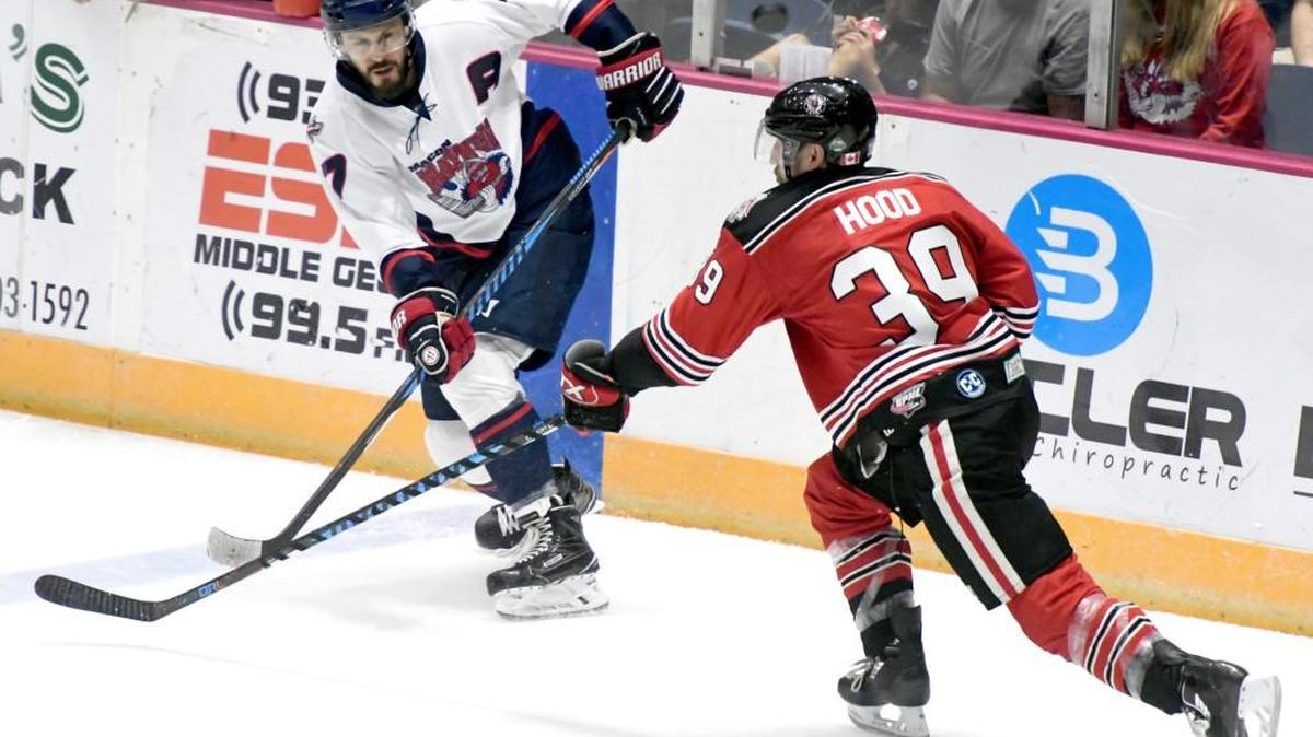 A shot by Mayhem defenseman Jeff Sanders (7) is deflected by Huntsville's Dylan Hood (39) Thursday night during game two of their SPHL semifinal series.