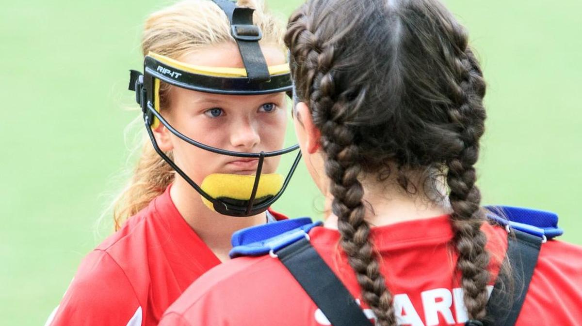Georgia’s pitcher Dixiana Sims listens to her catcher Megan Sharpe during Sunday’s game.