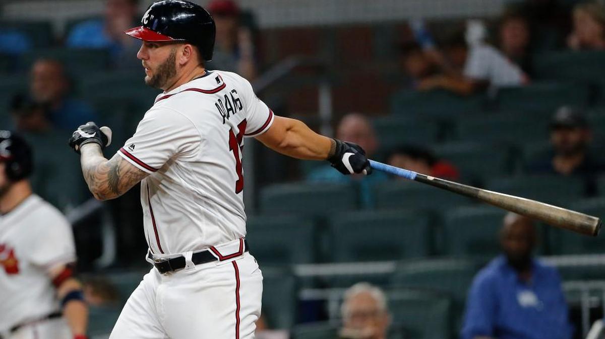 Atlanta’s Matt Adams drives in a run Monday against San Francisco.