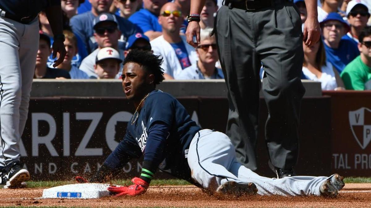Atlanta Braves Ozzie Albies (1) dives into third base during the first inning of a baseball game against the Chicago Cubs on Sunday, Sept. 3, 2017, in Chicago.