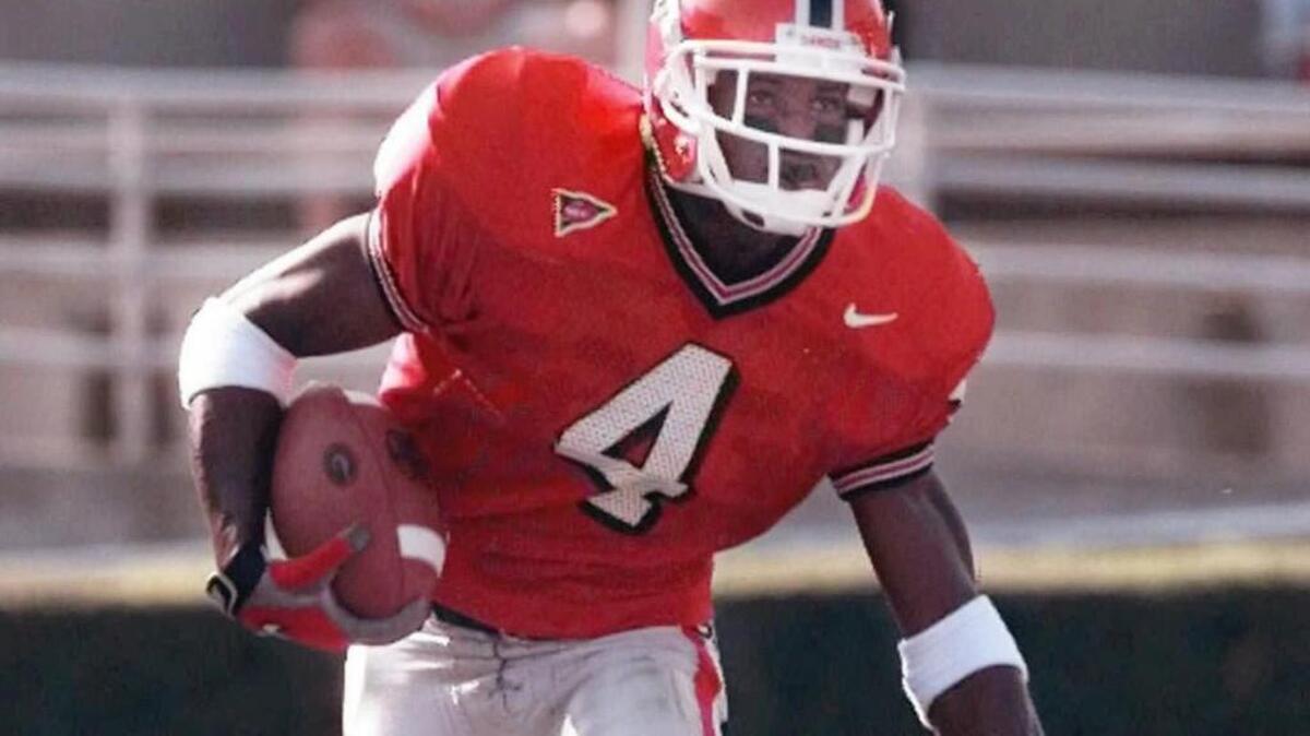 Georgia’s Champ Bailey looks for running room during a 1998 game in Athens.