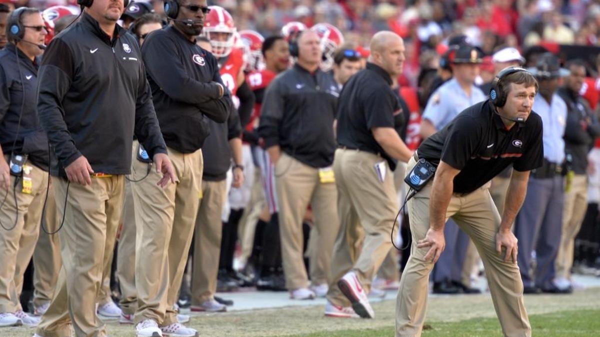 Kirby Smart, right, went 7-5 in his first regular season as Georgia’s head coach.