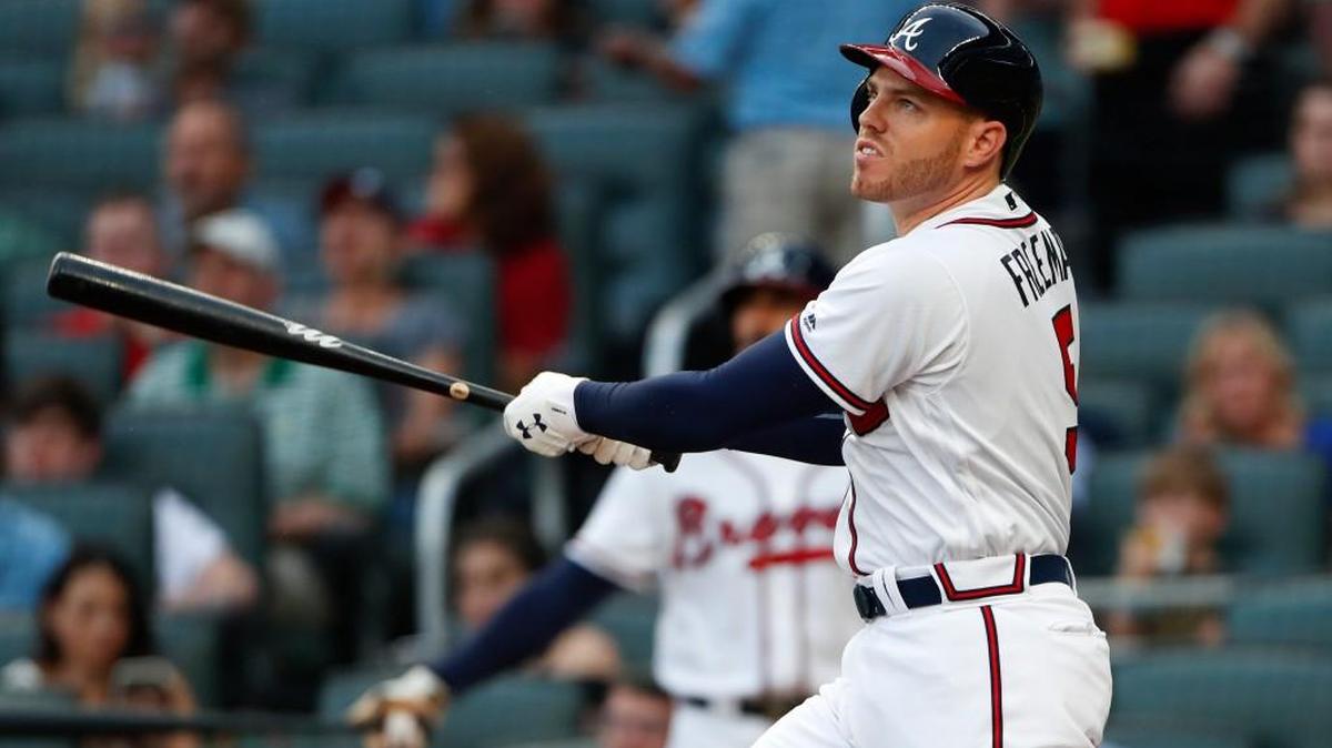 Atlanta Braves first baseman Freddie Freeman (5) follows through on a two-run home run in the first inning of Friday’s game against the San Francisco Giants in Atlanta.