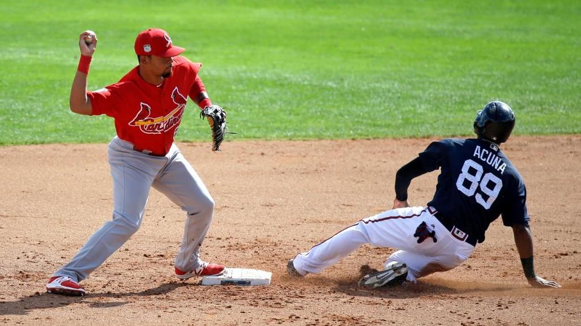 Atlanta’s Ronald Acuna (89) slides into second base in a spring training game last month.