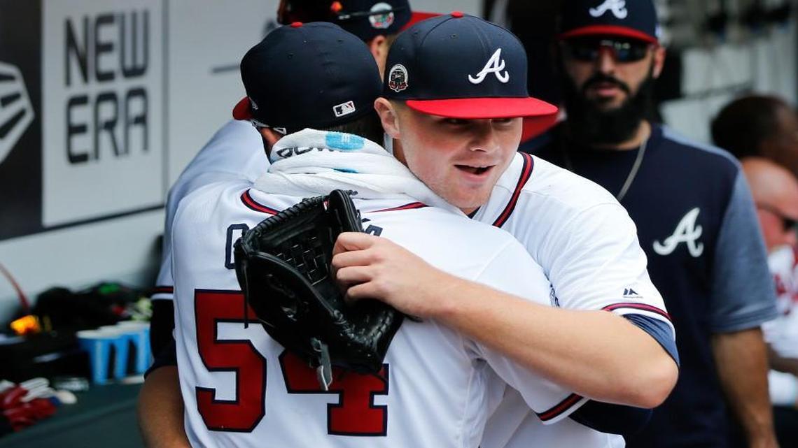 Atlanta Braves starter Sean Newcomb embraces Atlanta Braves starting pitcher Jaime Garcia (54) after finishing his major league debut Saturday.