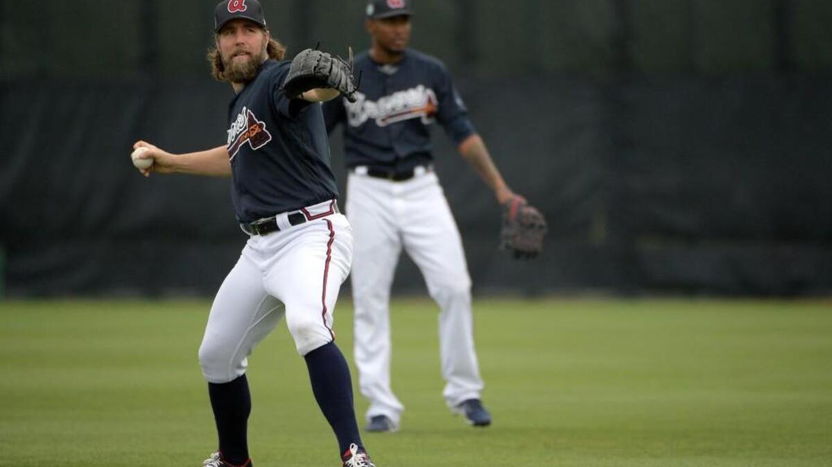 Atlanta Braves pitcher R.A. Dickey, left, is entering his first season with the franchise.