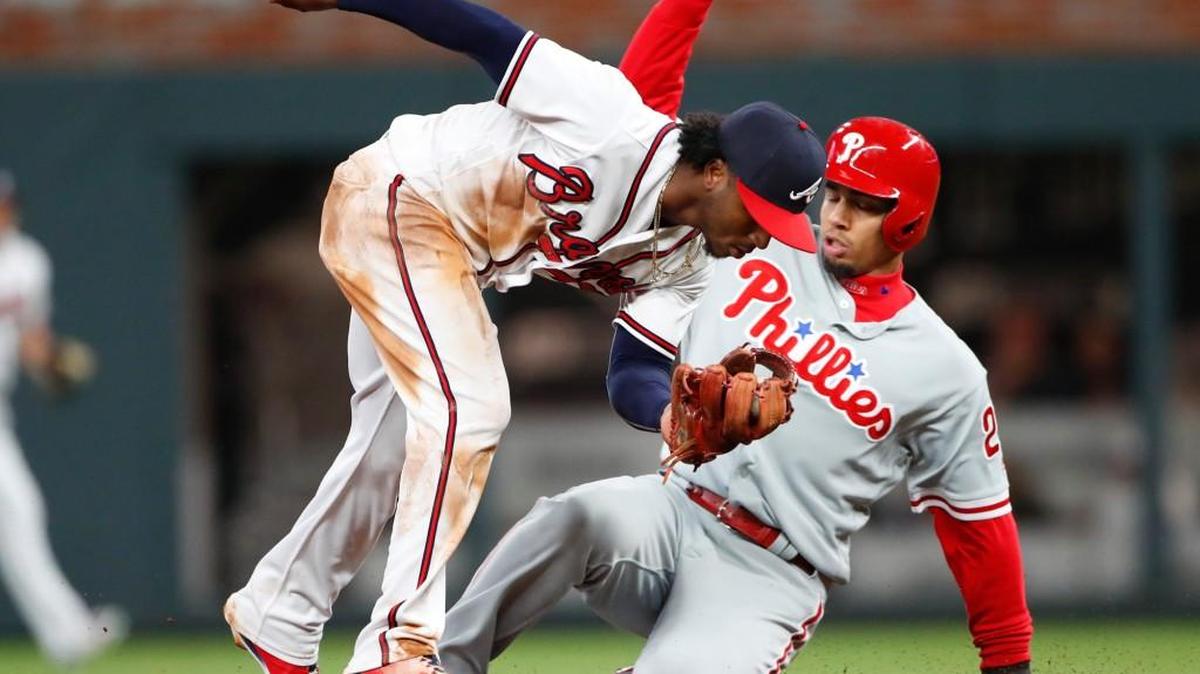 Philadelphia Phillies' Aaron Altherr (23) is forced out at second base by Atlanta Braves second baseman Ozzie Albies on Monday in Atlanta.