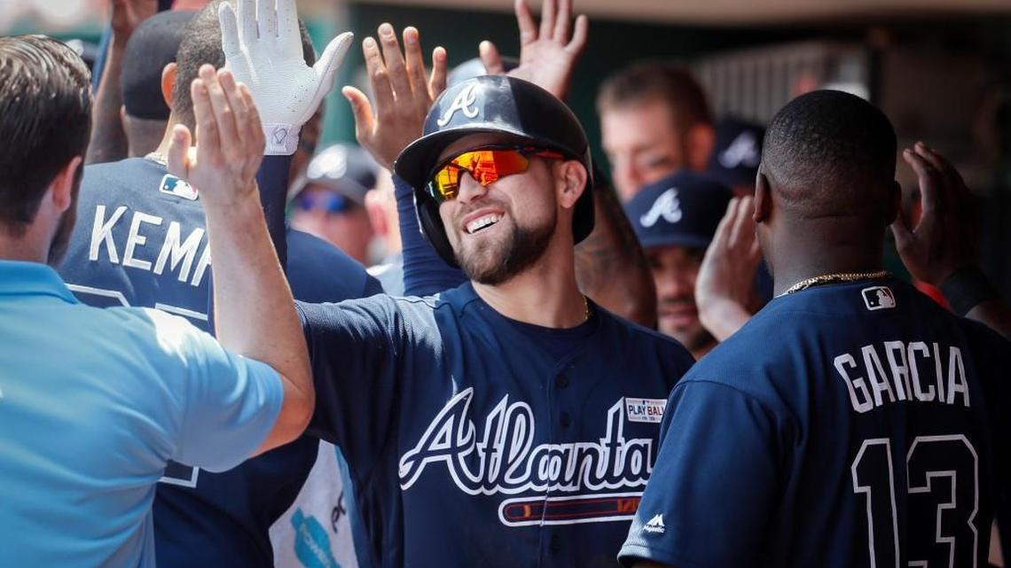 Atlanta’s Ender Inciarte, center, celebrates in the dugout after hitting a three-run home run off Cincinnati Reds starting pitcher Amir Garrett in the third inning of a baseball game, Sunday, June 4, 2017.