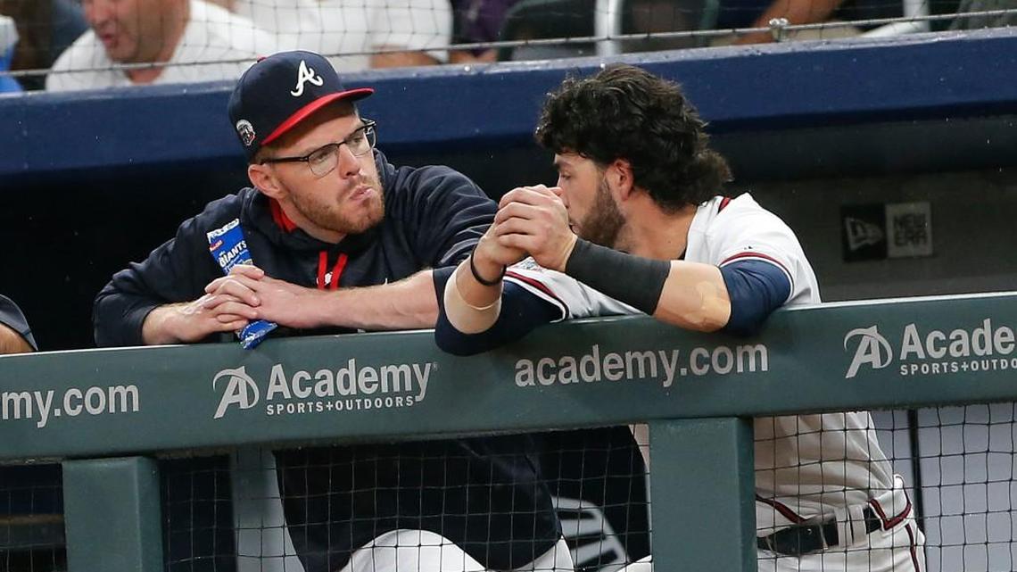 Freddie Freeman, left, and Dansby Swanson talk during Wednesday’s Atlanta Braves game.
