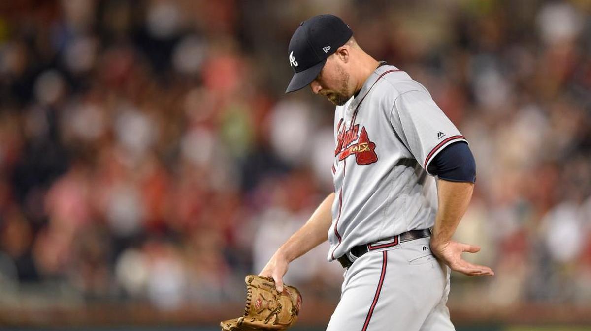 Atlanta Braves relief pitcher Jim Johnson walks to the dugout after he was pulled from a baseball game during the ninth inning against the Washington Nationals, Friday, July 7, 2017, in Washington.