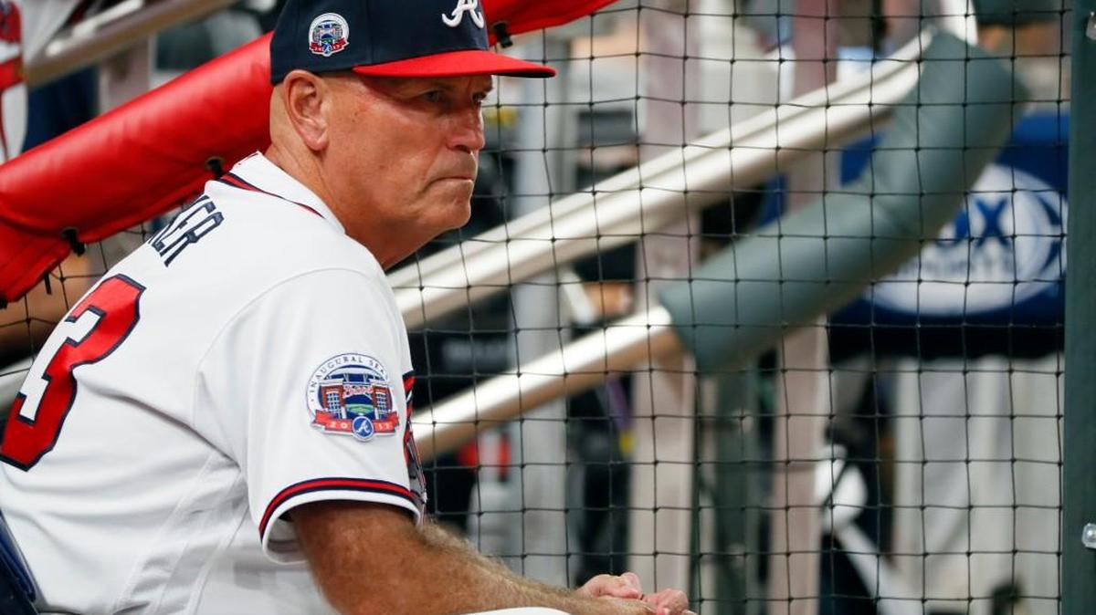 FILE - In this Sept. 22, 2017, file photo, Atlanta Braves manager Brian Snitker watches from the dugout during the sixth inning of a baseball game against the Philadelphia Phillies in Atlanta.