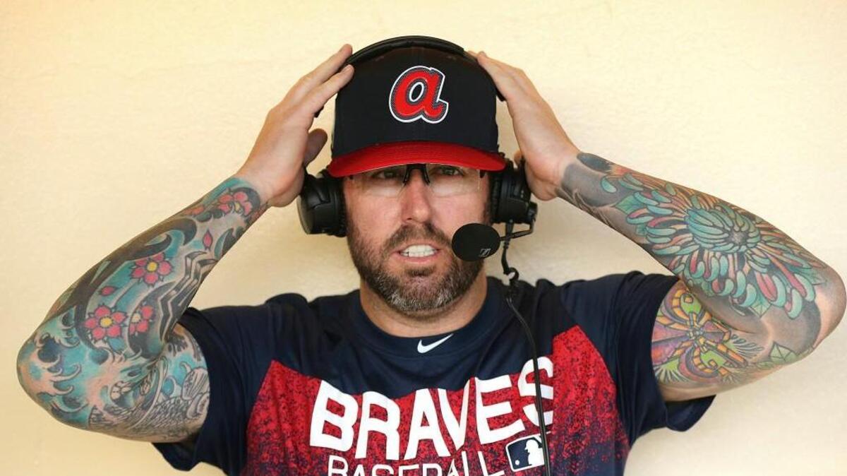 Atlanta Braves relief pitcher Peter Moylan, who signed with the Braves on Monday, does an interview from the team dugout at baseball spring training in Kissimmee, Fla., on Tuesday.