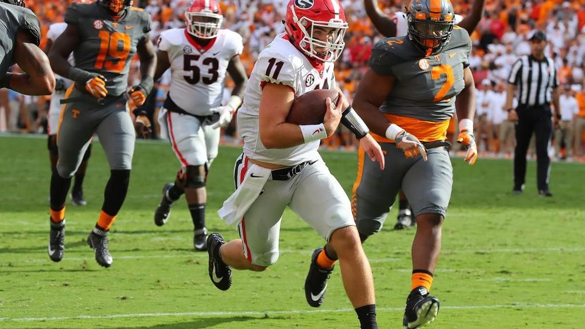 Georgia quarterback Jake Fromm (11) heads to the end zone on a 9-yard quarterback keeper Saturday.