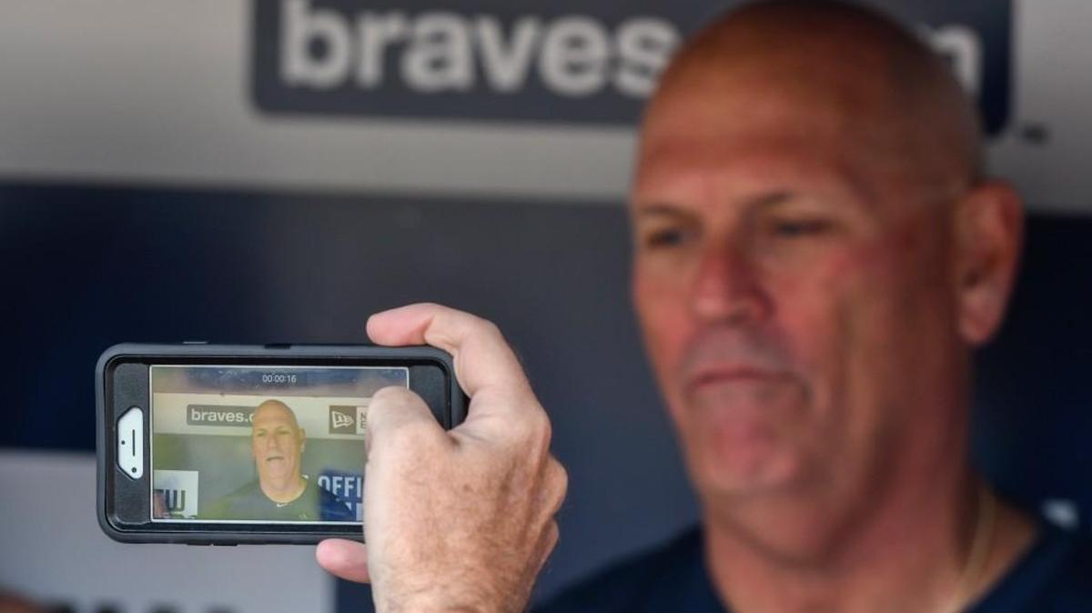 Atlanta Braves interim manager Brian Snitker is interviewed by the media before the Braves' final baseball game at Turner Field before playing the Detroit Tigers on Sunday.