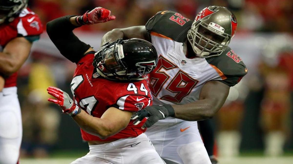 Tampa Bay Buccaneers tackle Demar Dotson (69) blocks Atlanta Falcons linebacker Vic Beasley (44) during Sunday’s game.