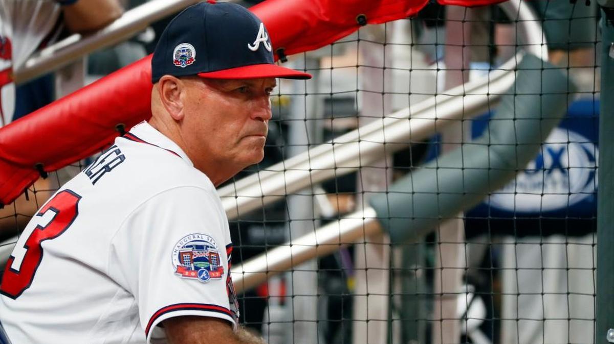 In this Sept. 22, 2017, file photo, Atlanta Braves manager Brian Snitker watches from the dugout during the sixth inning of a game against the Philadelphia Phillies in Atlanta