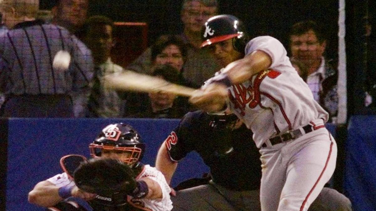Atlanta’s Andrew Jones connects for an RBI single against the San Diego Padres in the fourth inning of Game 5 of the NLCS.
