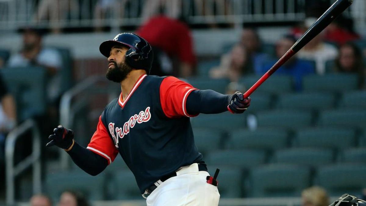 Atlanta Braves' Matt Kemp watches the flight of a two-run home run during the first inning of a baseball game against the Colorado Rockies on Friday, Aug. 25, 2017, in Atlanta. Kemp is returning to the Los Angeles Dodgers as part of a five-player trade with the Atlanta Braves that includes cash.