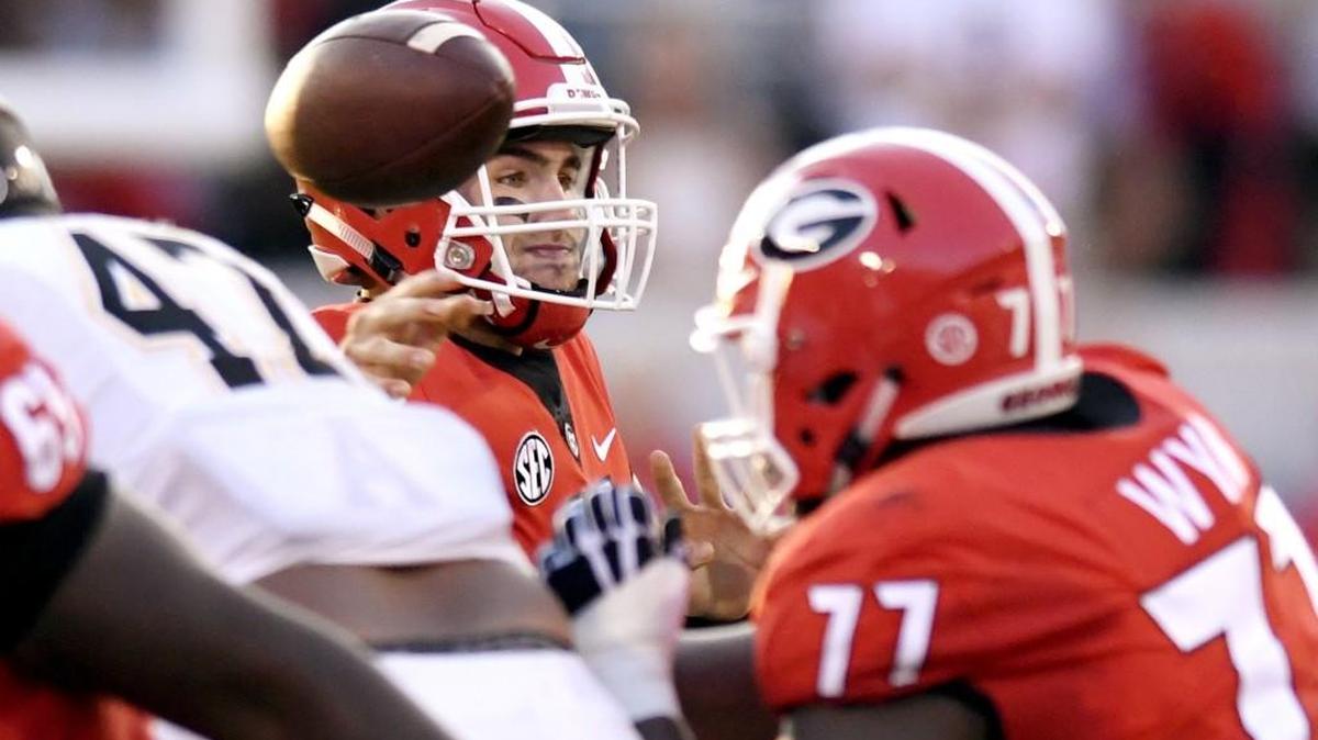Georgia quarterback Jake Fromm (11) throws a pass toward the sideline during the Bulldogs' opening game against Appalachian State Saturday.