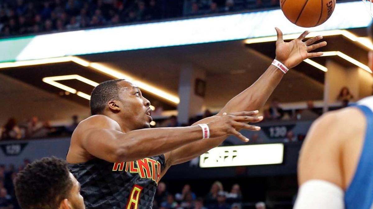 Dwight Howard, left, is averaging a double-double in his first season with the Atlanta Hawks.