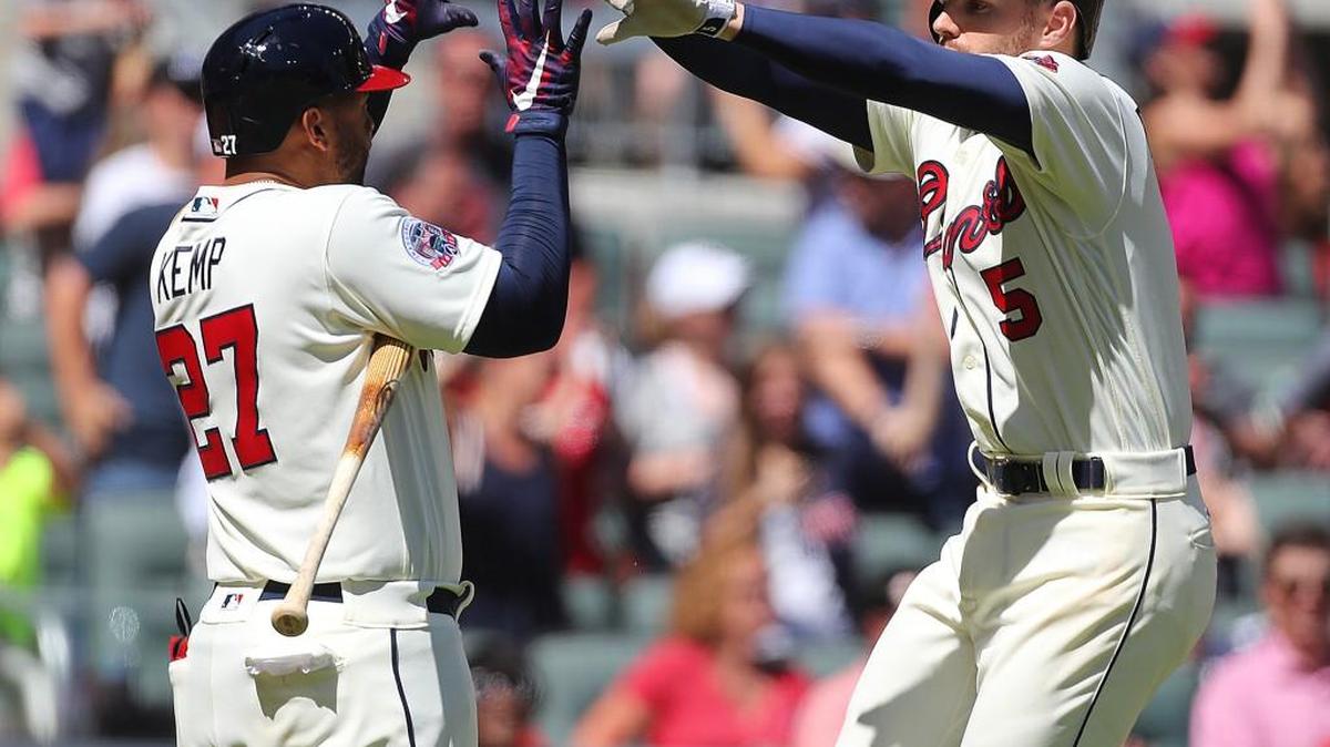 Atlanta’s Freddie Freeman, right, had 12 home runs and 20 RBI entering Saturday’s game.