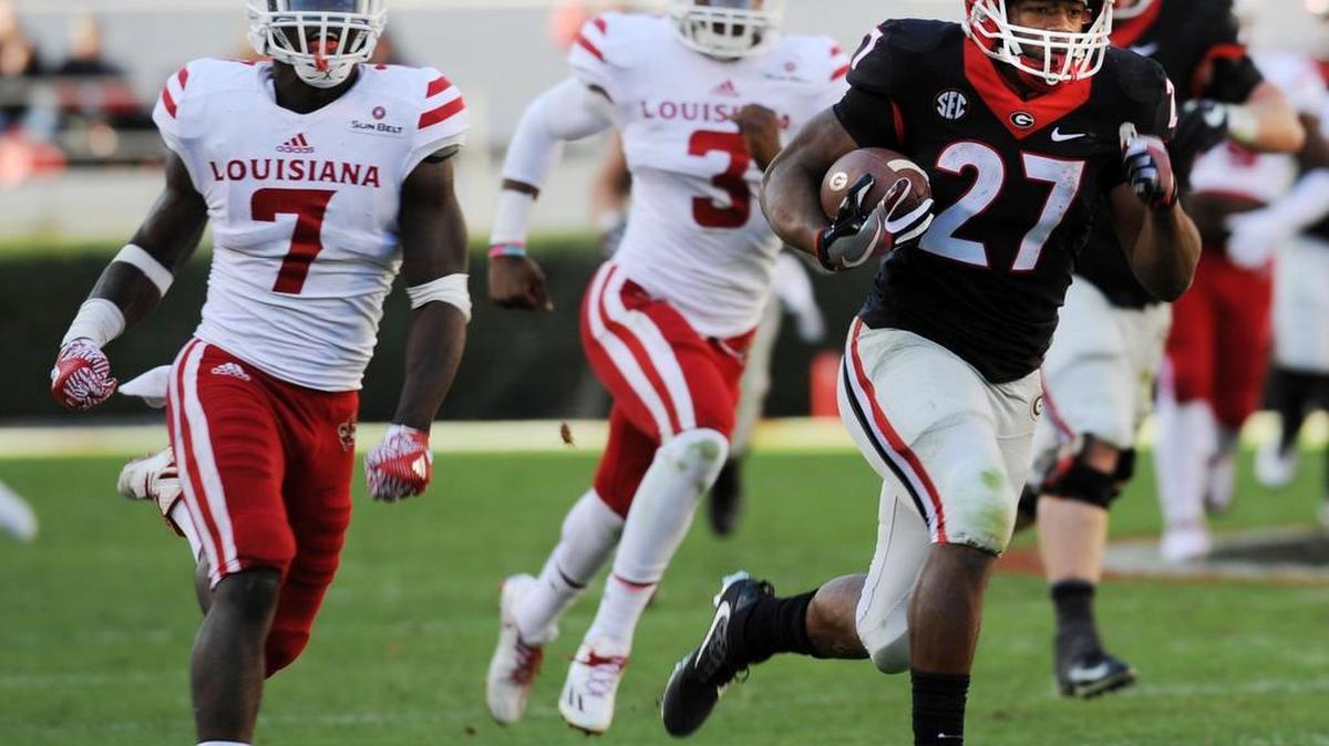 Georgia running back Nick Chubb (27) turns a short pass into a 49-yard touchdown during fourth-quarter action Saturday against Louisiana-Lafayette.