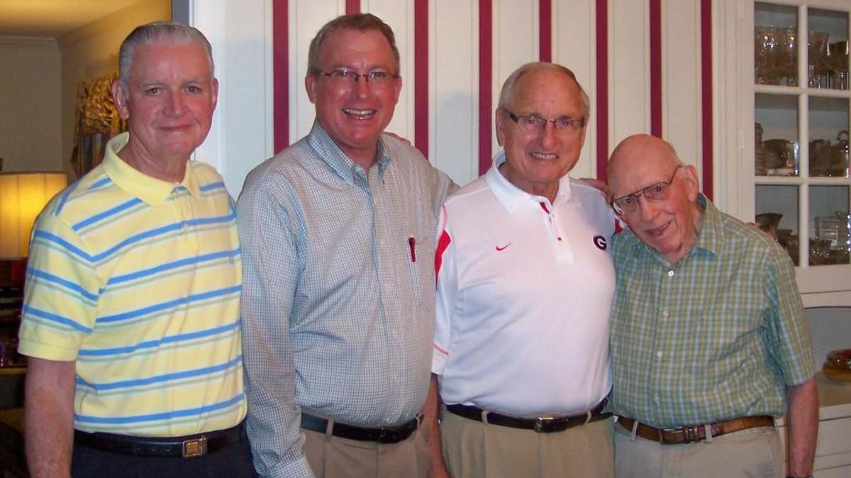Former Macon County head coach Jimmy Maffett, right, poses with Billy Powell, left, Billy Kimbrel and former Georgia head coach Vince Dooley.
