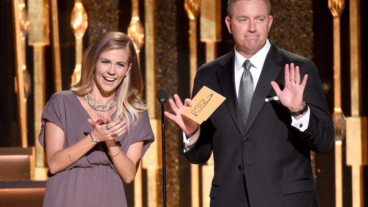 Samantha Ponder, left, and Kirk Herbstreit present the award for vocal duo of the year at the 50th annual CMA Awards at the Bridgestone Arena on Wednesday, Nov. 2, 2016, in Nashville, Tenn.