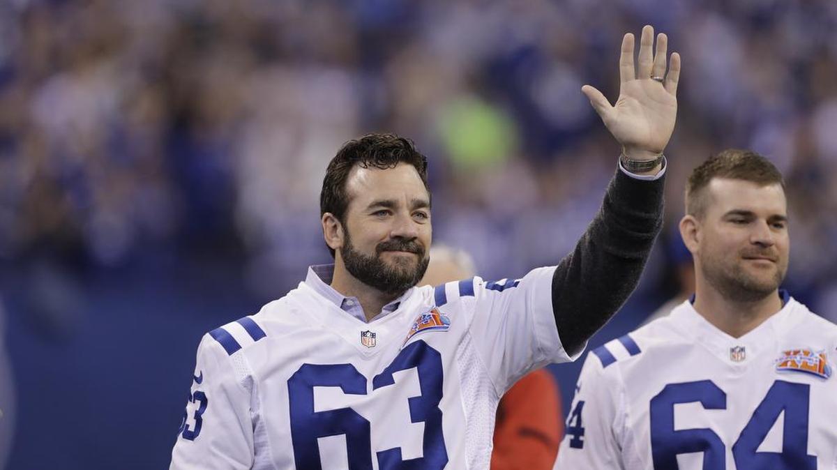 Former Indianapolis Colts center Jeff Saturday waves to fans as the team honored the 2006 Super Bowl winning team during halftime of an NFL football game in Indianapolis, Sunday, Nov. 20, 2016.