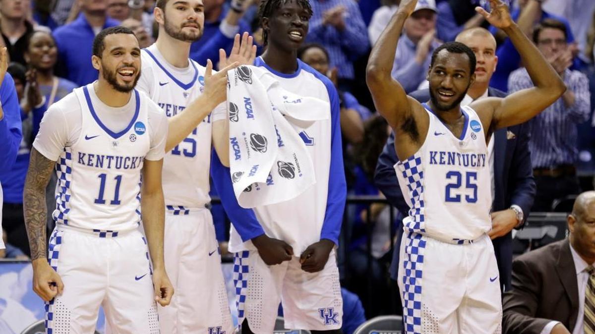 The Kentucky bench celebrates during the second half of a second-round game against Wichita State in the men’s NCAA college basketball tournament in Indianapolis.
