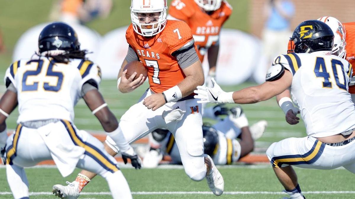 Mercer quarterback John Russ (7) scrambles for a first down during their game against East Tennessee State on Saturday.
