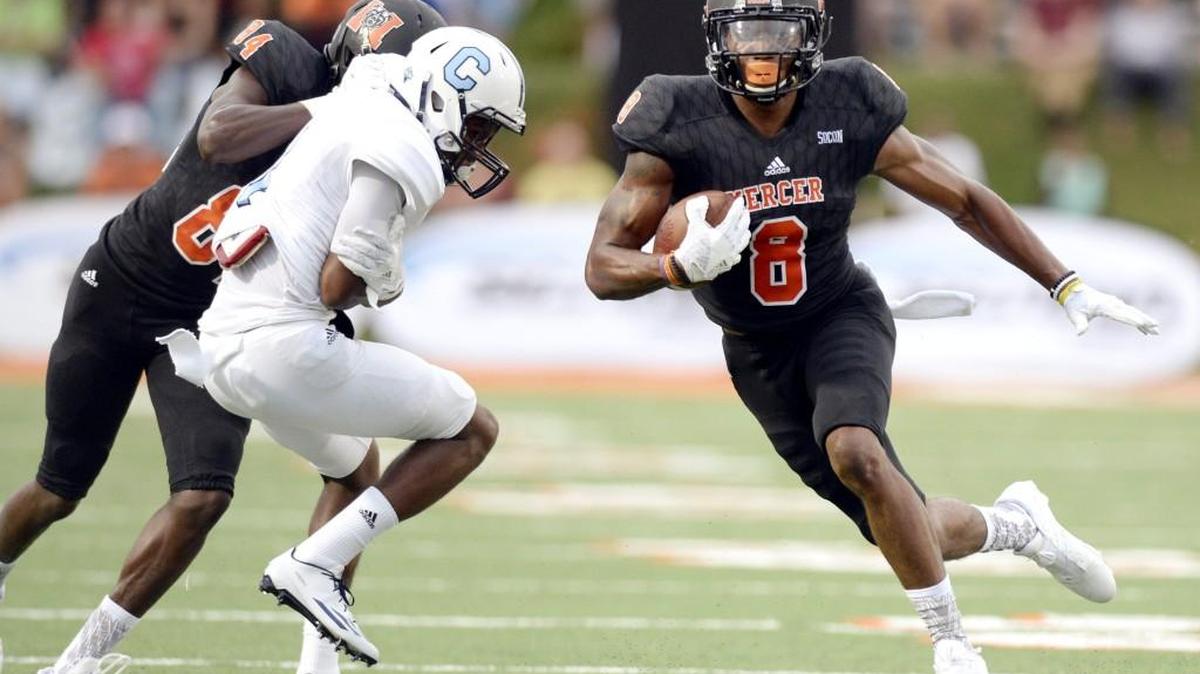 Mercer receiver Marquise Irvin (8) gets a block from teammate Avery Ward (84) on a wide receiver screen during the Bears' game against The Citadel Thursday night.