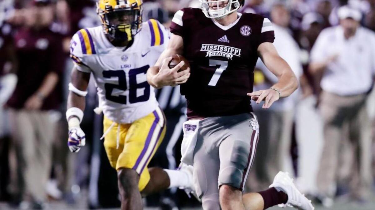 Mississippi State quarterback Nick Fitzgerald (7) sprints past LSU safety John Battle (26) for a first down during the second half of their NCAA college football game in Starkville, Miss., Saturday, Sept. 16, 2017. Mississippi State won 37-7.